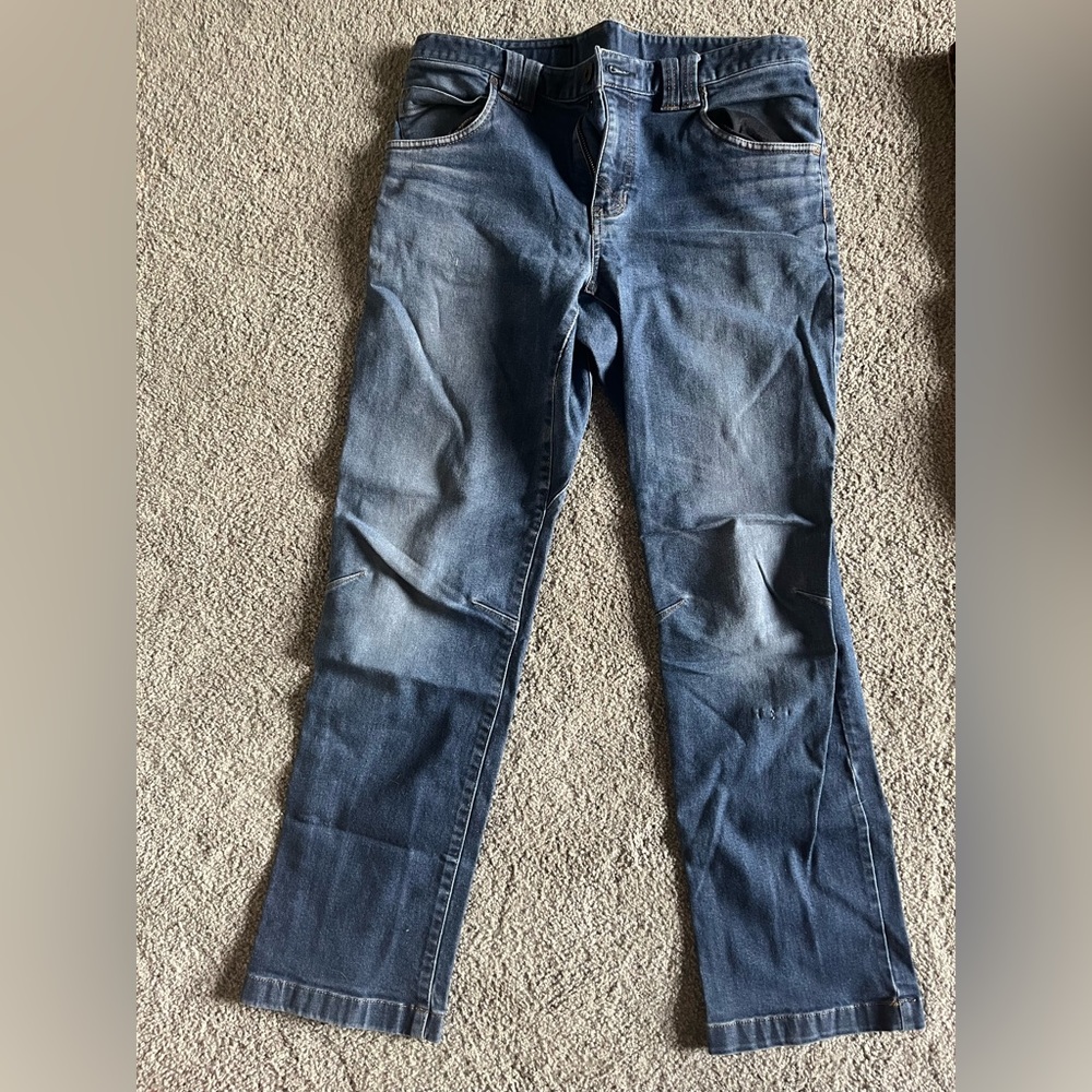 Eddie Bauer slim tapered stretchy blue jeans.